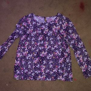 Long sleeve kids blouse. Button in back.